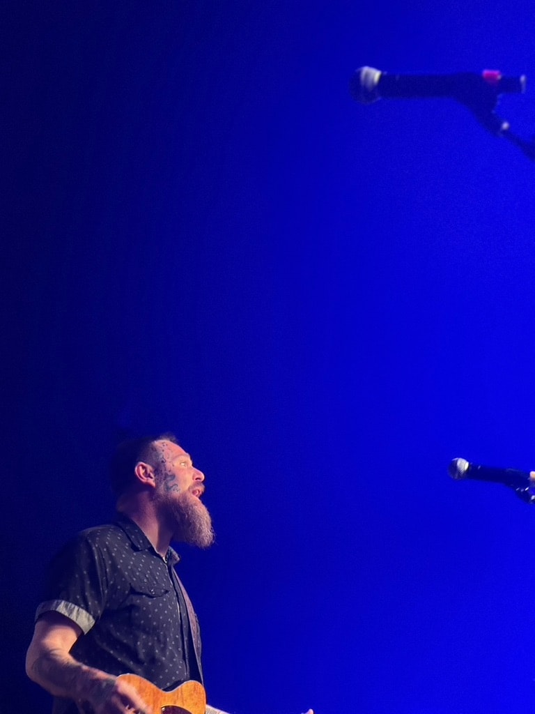 Andy Hughes performing at an outdoor festival