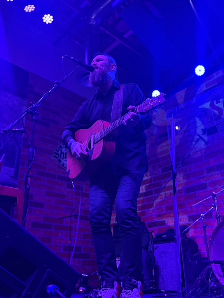Andy Hughes performing live on stage